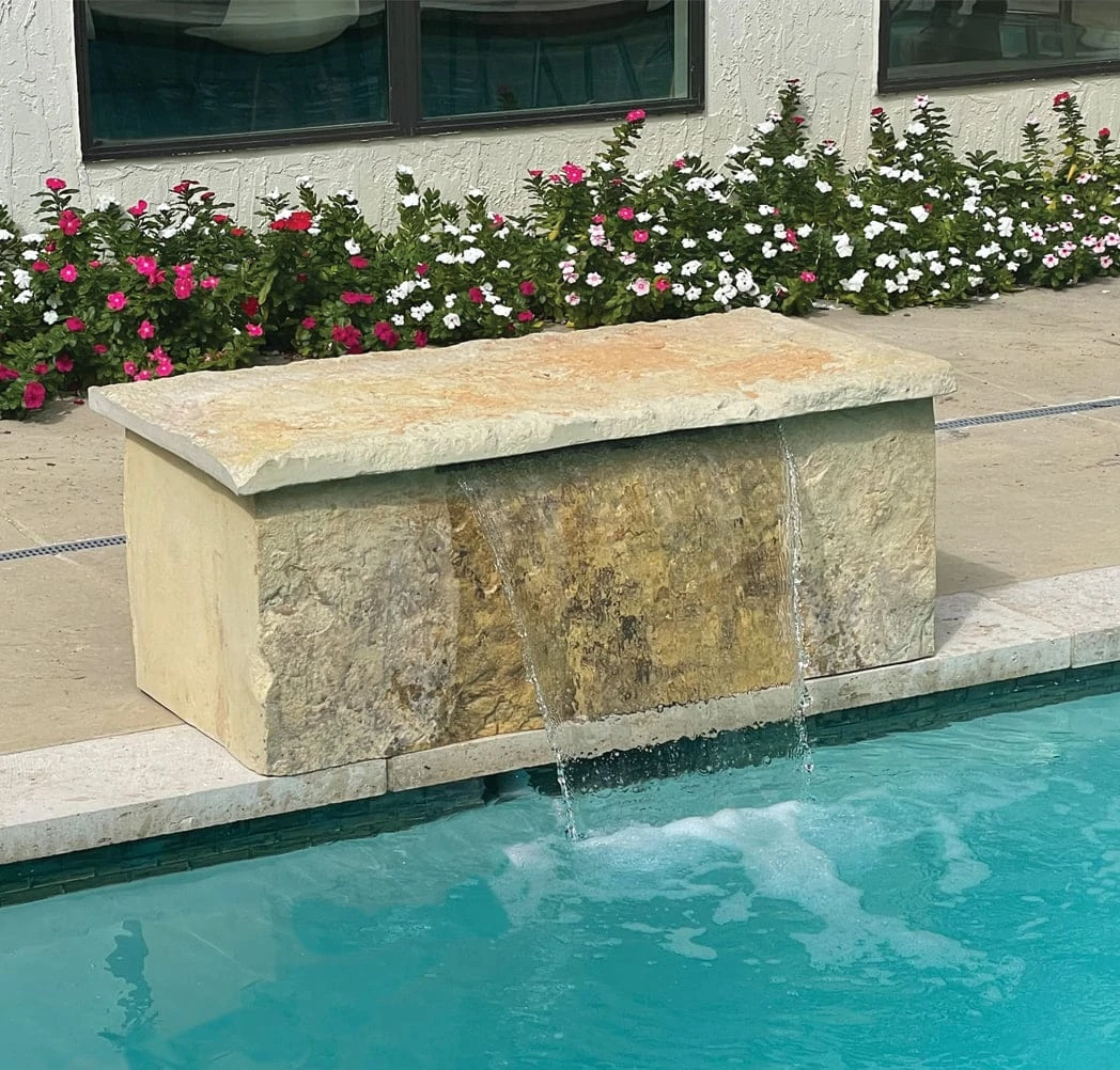 Modern Bench Fall cast rock feature installed on a pool