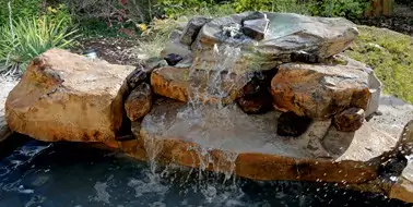 Boulder Two-Step cast rock feature installed on a pool