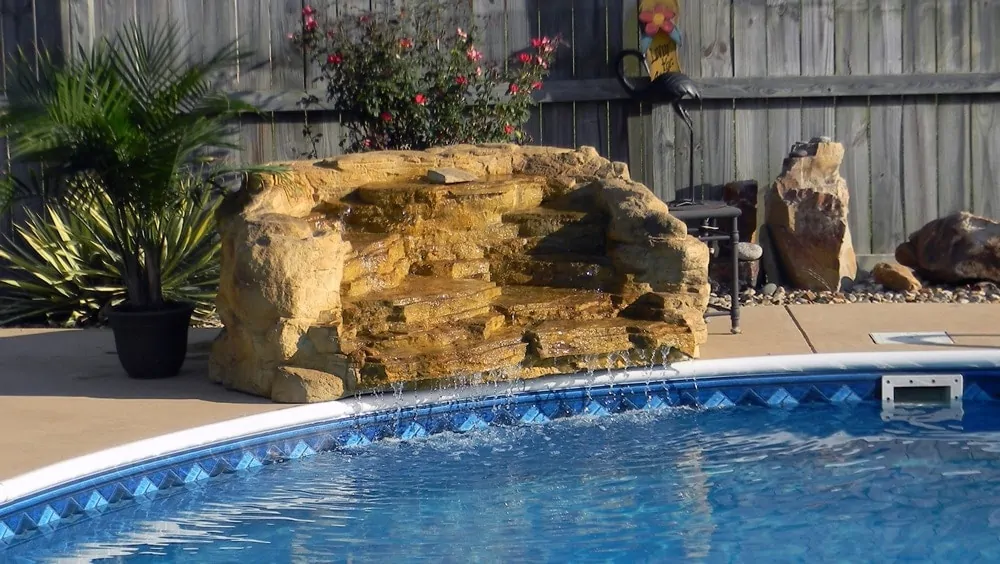 Spring Step cast rock feature installed on a pool