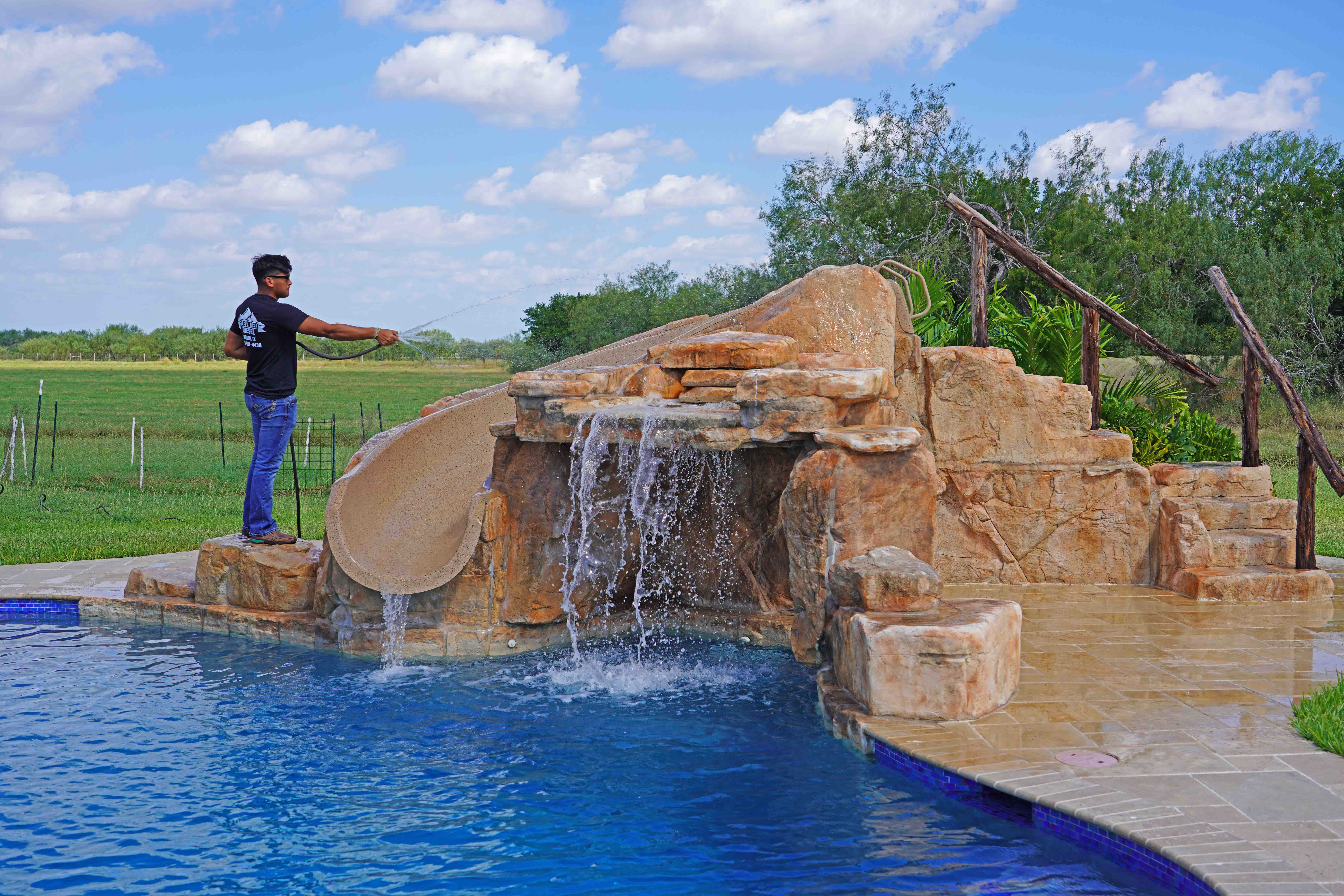 Grotto Bench cast rock feature installed on a pool