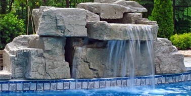 Sheet Fall cast rock feature installed on a pool