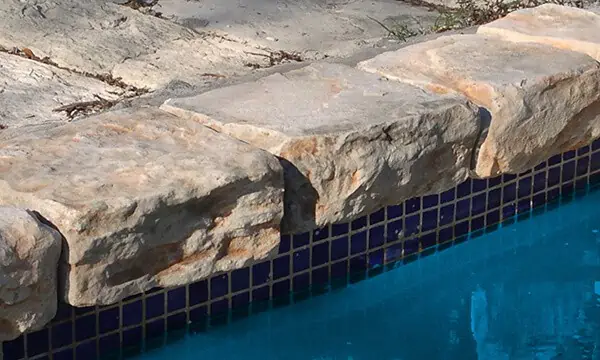 Rock Coping cast rock feature installed on a pool